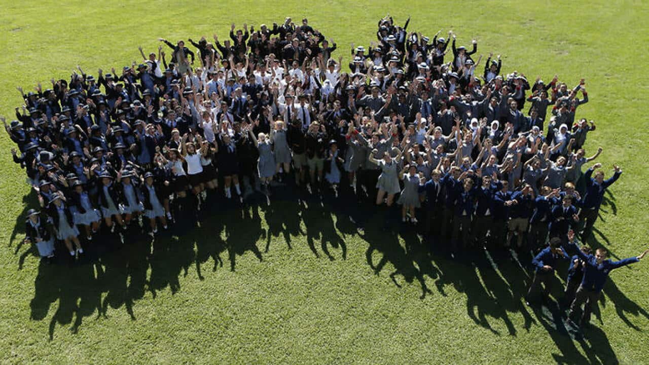 A stock image of school children forming an Australia map at The Domain in Sydney, Wednesday, April 2, 2014. (AAP Image/Daniel Munoz) NO ARCHIVING