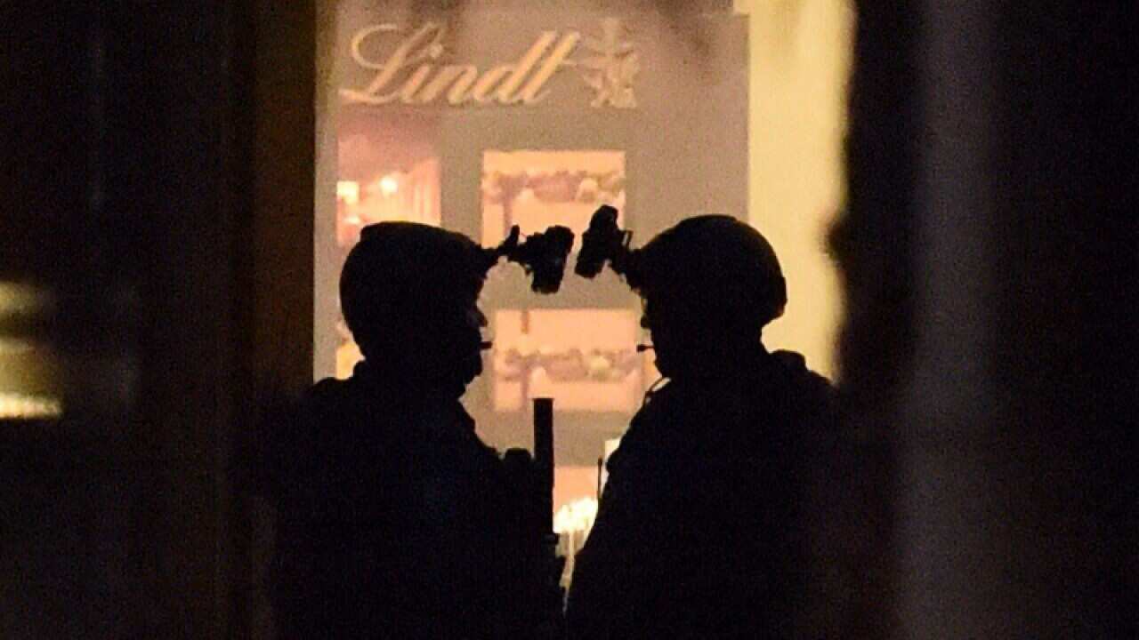 Police storm the Lindt chocolate cafe in Martin Place
