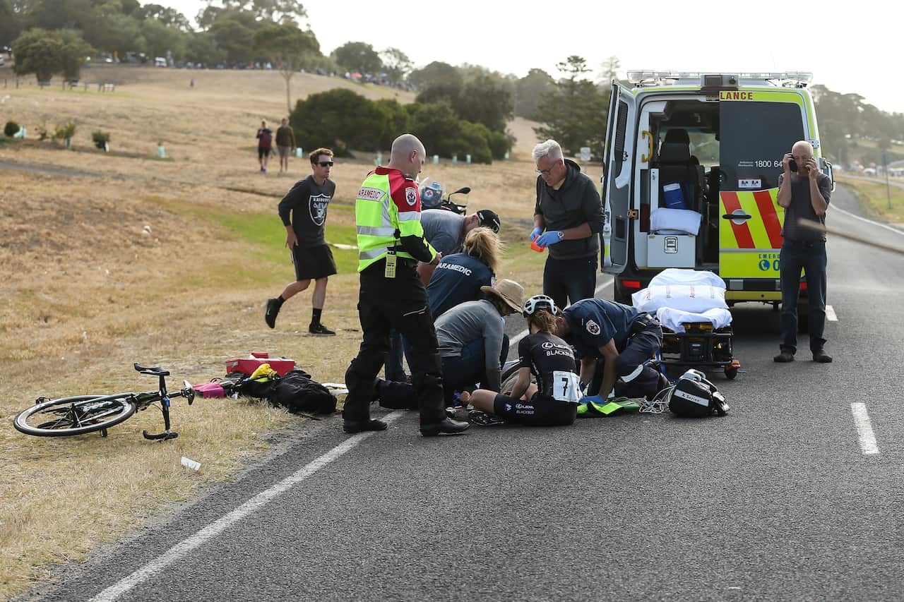 Shannon Malseed receives medical attention as a concerned Sarah Gigante looks on 