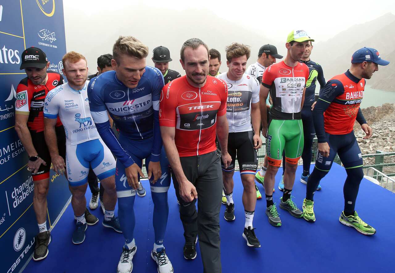 The peloton react on the podium of the 4th stage of the Dubai Tour 2017 cycling race, the The Westing stage of 200km. The race was canceled for to much. wind. United Arab Emirates, 3 February 2017.ANSA / MATTEO BAZZI