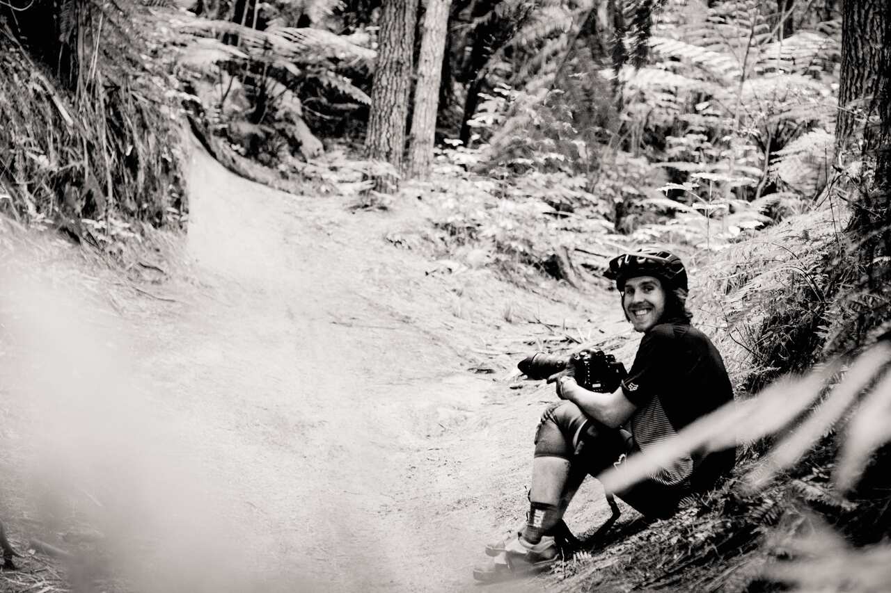 Photographer, Paris Gore, waits on the trails for the perfect light.