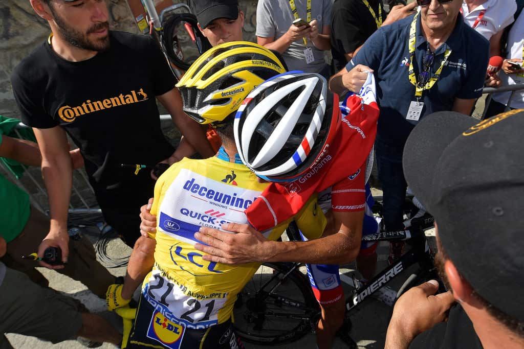 Julian Alaphilippe and Thibaut Pinot embrace at the finish on the Tourmalet at the 2019 Tour de France 
