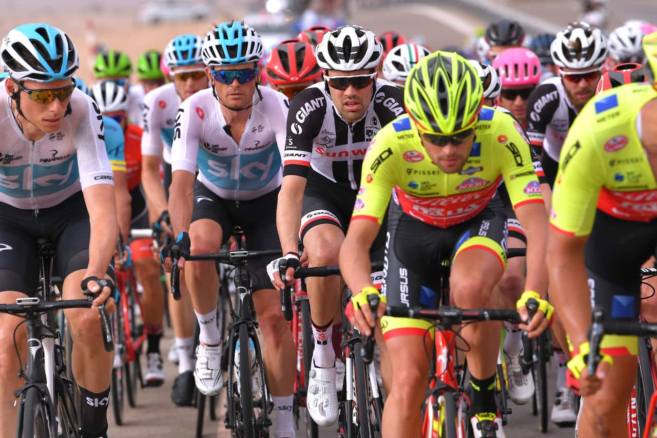 Low profile... After making a big statement in Jerusalem, defending champ Tom Dumoulin (C) was happy to lose the lead.