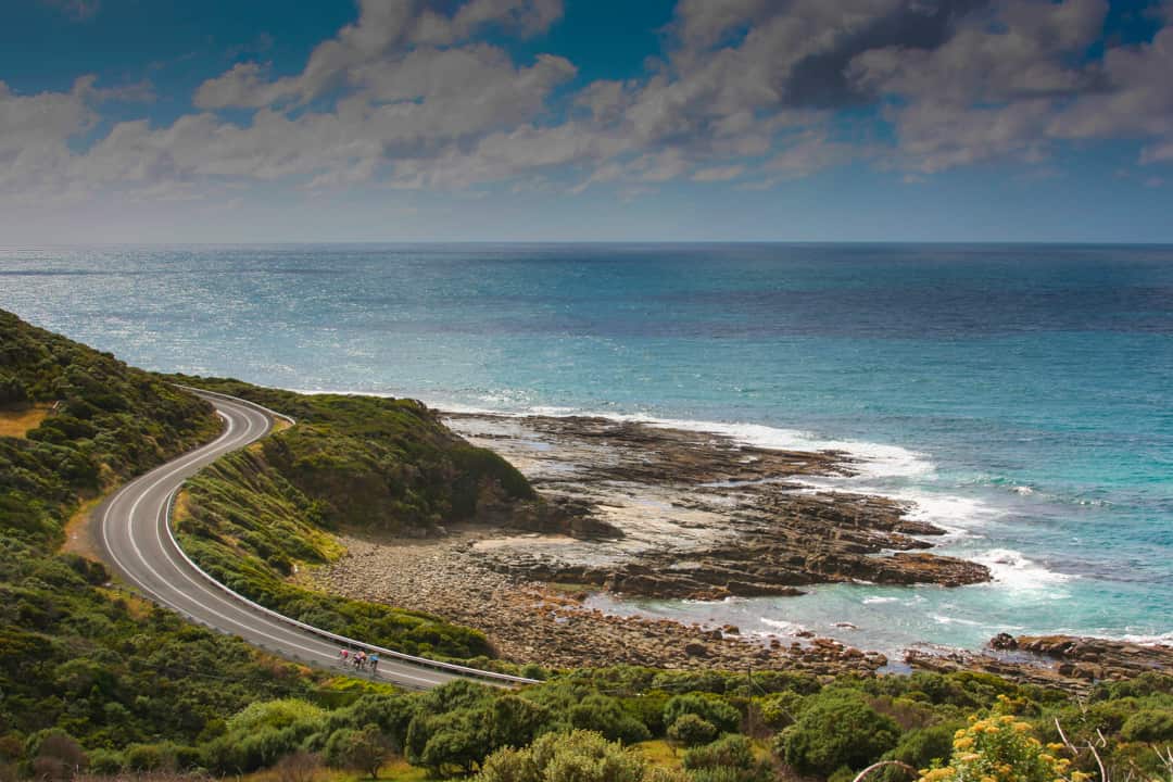Cyclist on the twisty road to Cape Patton, The Great Ocean Road, Victoria, Australia
