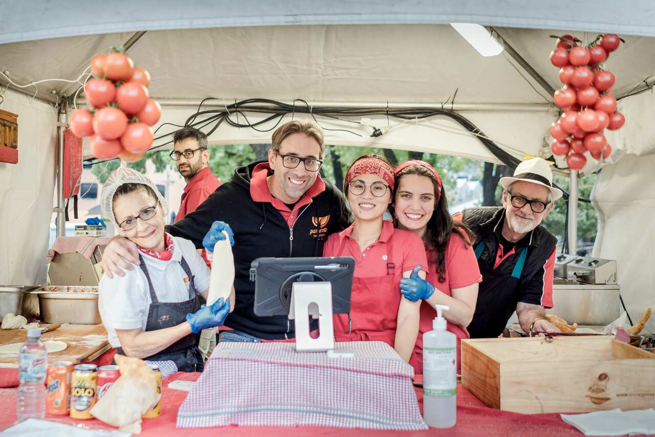 Ettore Donnaloia and his staff serving his bolognese panzerotto at his travelling market stall in Melbourne.