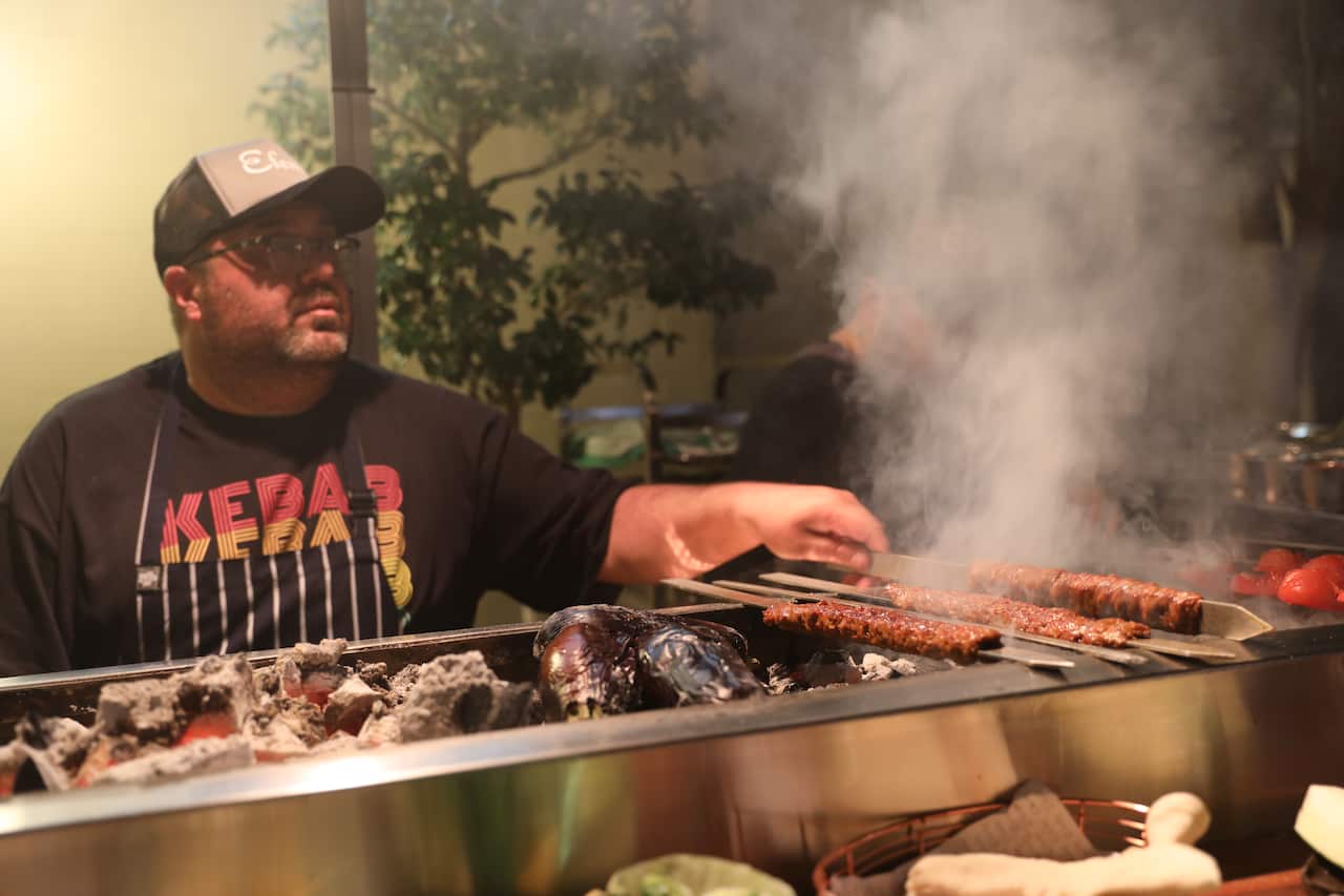 Somer Sirvioglu grilling kebabs