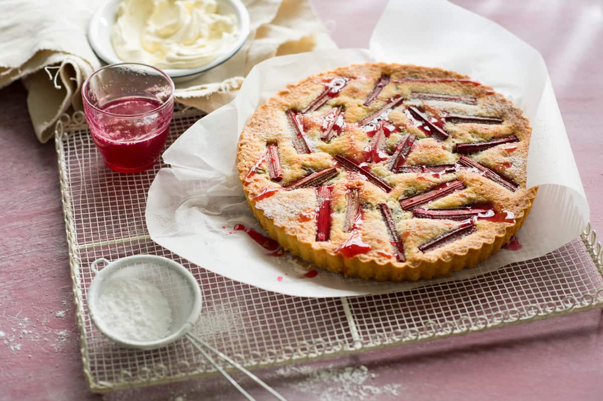 Rhubarb, pistachio and orange blossom frangipane tart with rhubarb syrup