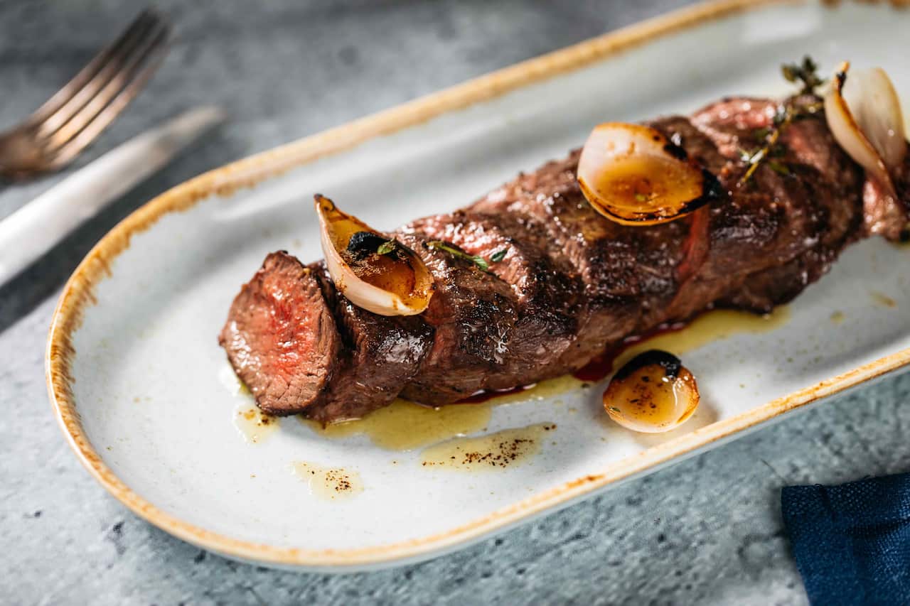 Charred venison and pickled onions