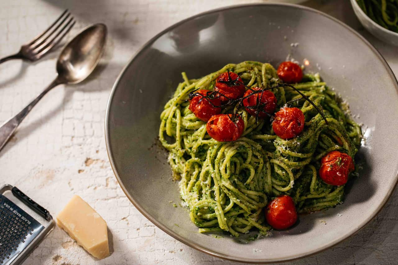 Pesto pasta with blistered baby vine tomatoes