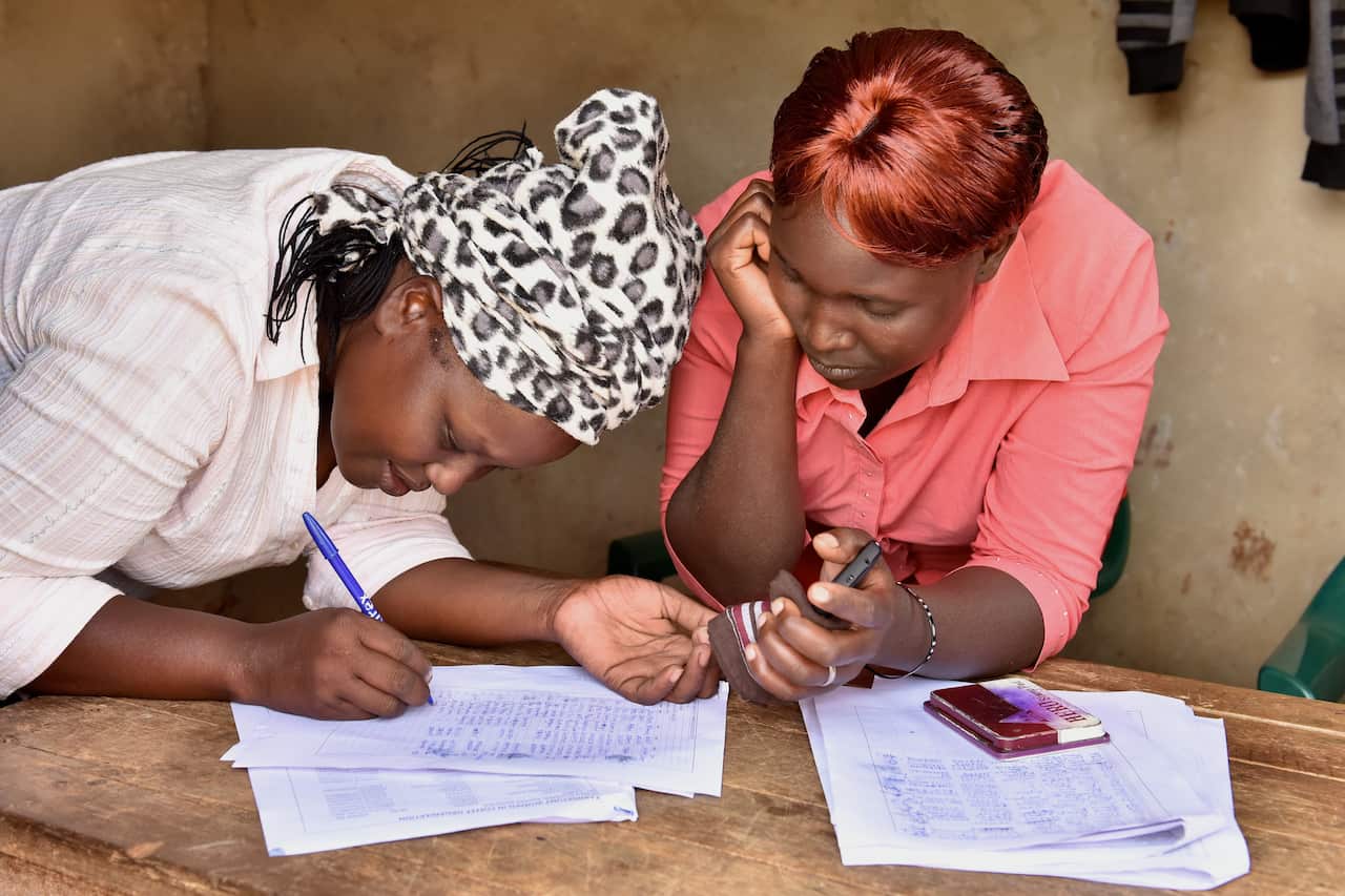 Zeddy Rotich (Right) with other members of Kabngetuny Women in Coffee.