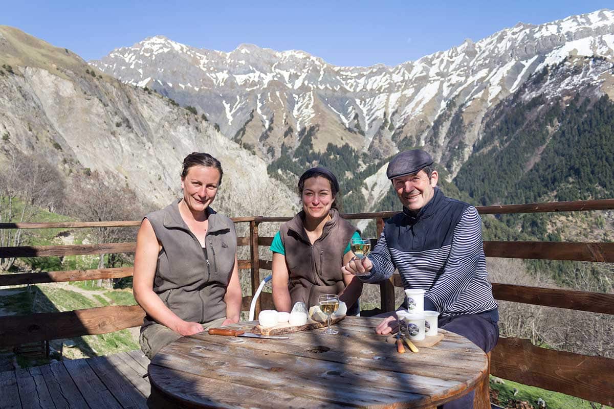 Gabriel talks cheese with cheesemakers Morgane and Mélanie in the Alps.