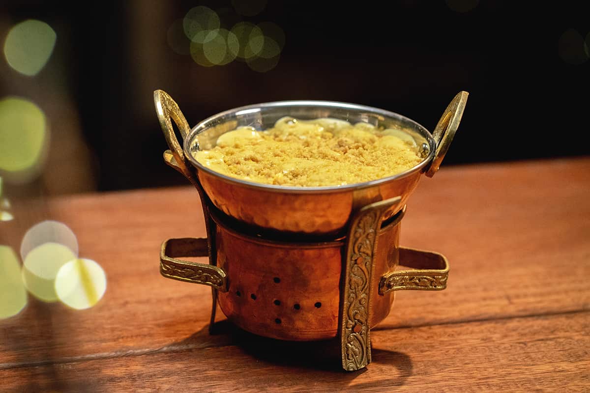 Zabaglione with almond polenta crumb and cherries in amarene syrup