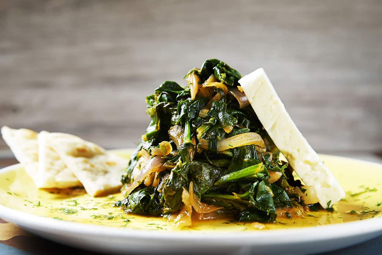 Tsigareli - braised greens with tomato and feta