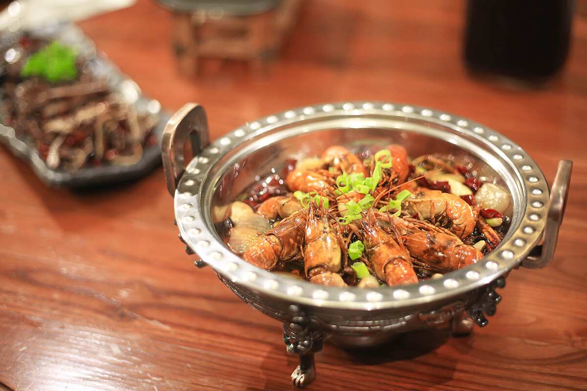 Distinctly Hunanese proteins include crayfish and abalone.