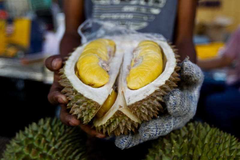 In this Nov. 25, 2017, file photo, a cut Musang King durian is shown by a vendor during the International Durian Cultural Tourism Festival in Bentong, Malaysia.