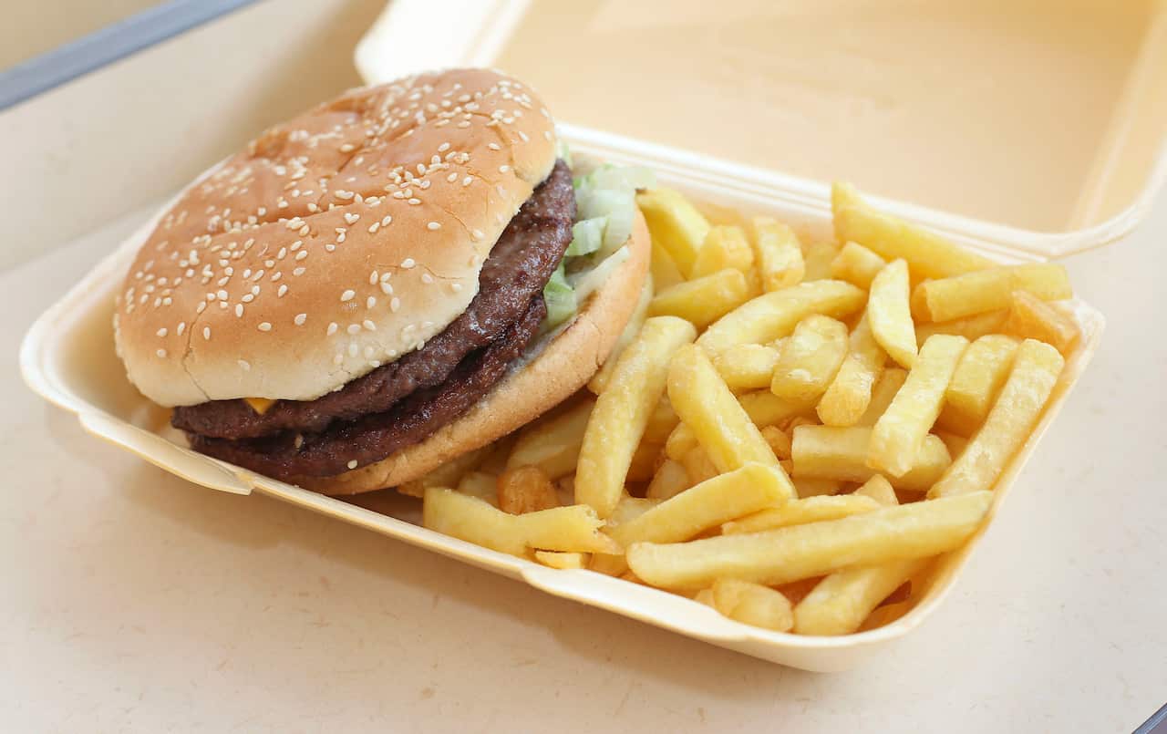 A generic stock photo of a half-pounder burger and chips in a takeaway carton.. Picture date: Wednesday July 9, 2014. Photo credit should read: Philip Toscano/PA Wire