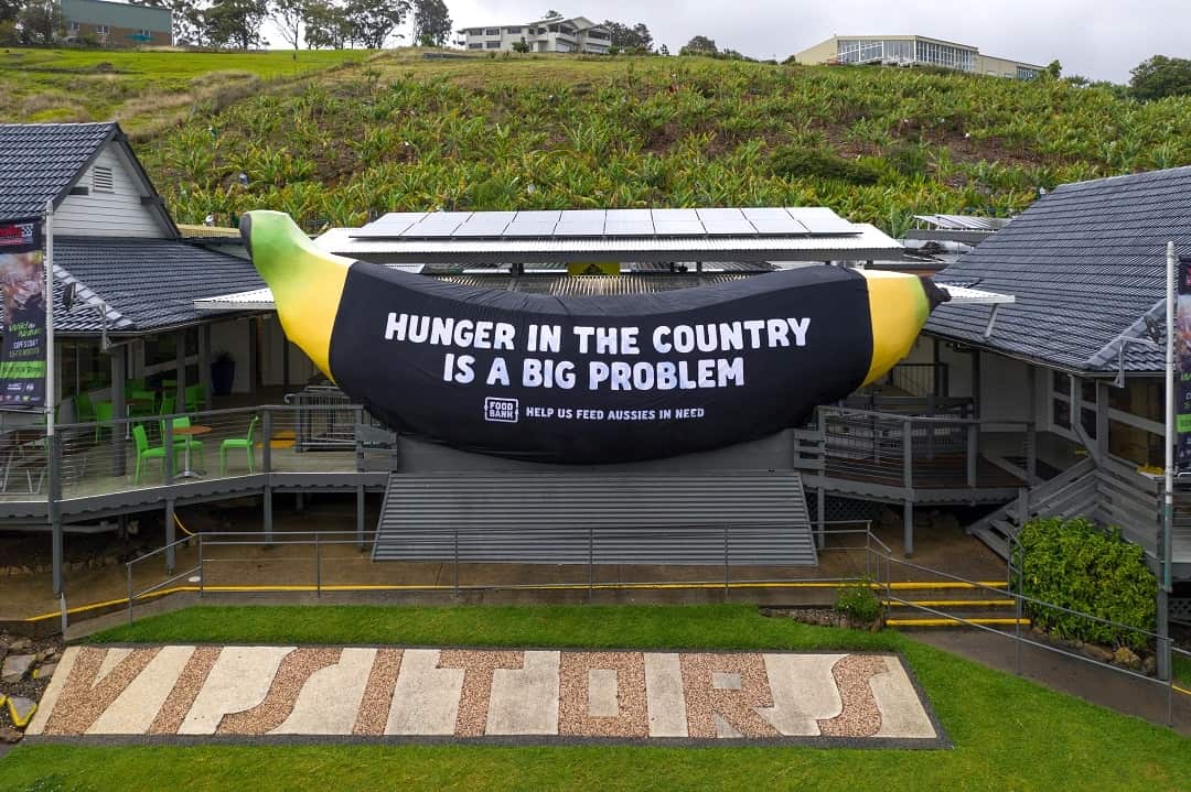 The Big Banana turns black as a new report shows 4 million Australians have experienced food insecurity in the past 12 months. 