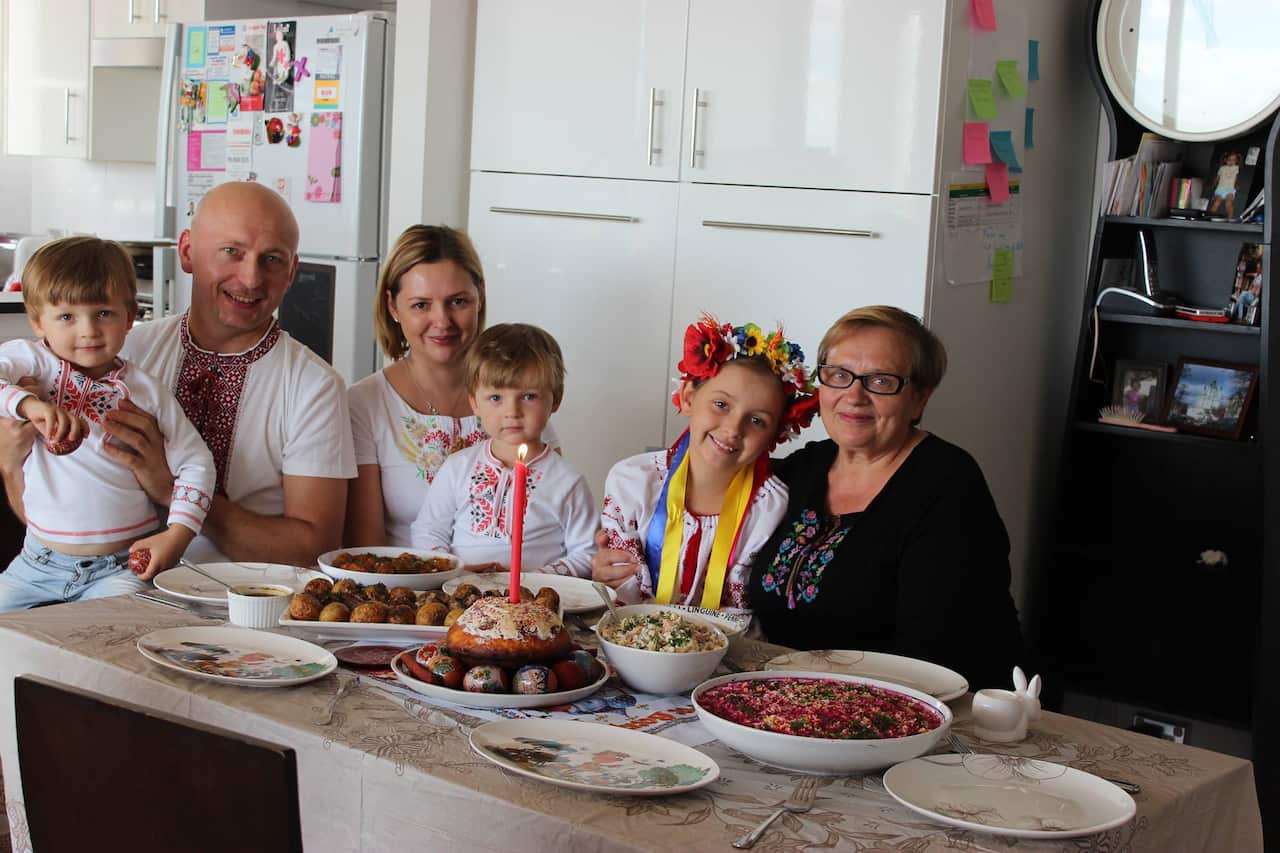Oleg, his wife Oksana, sons Timothy and Daniel, daughter Anastasia and mother-in-law Neila with a Ukrainian spread.