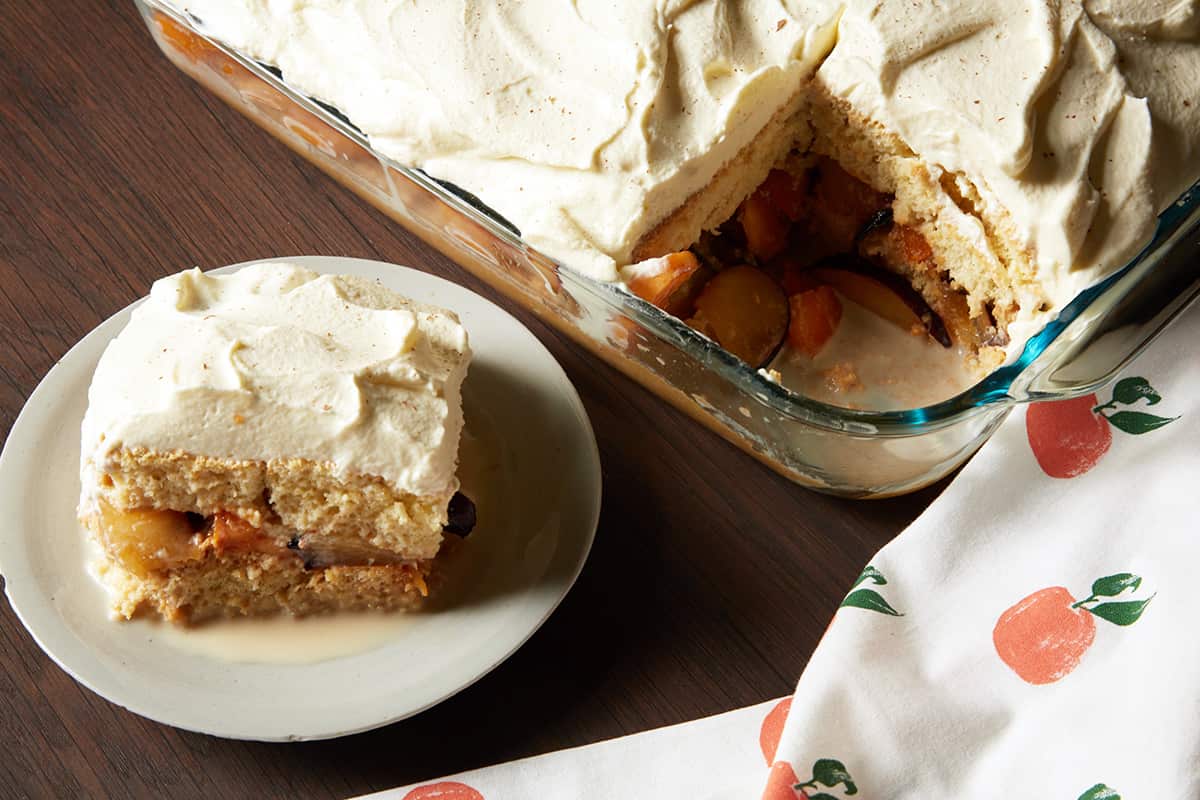 Cuatro leches cake with plums and apricots