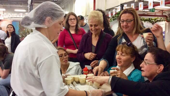 People enjoying halloumi at the Halloumi Festival in Melbourne