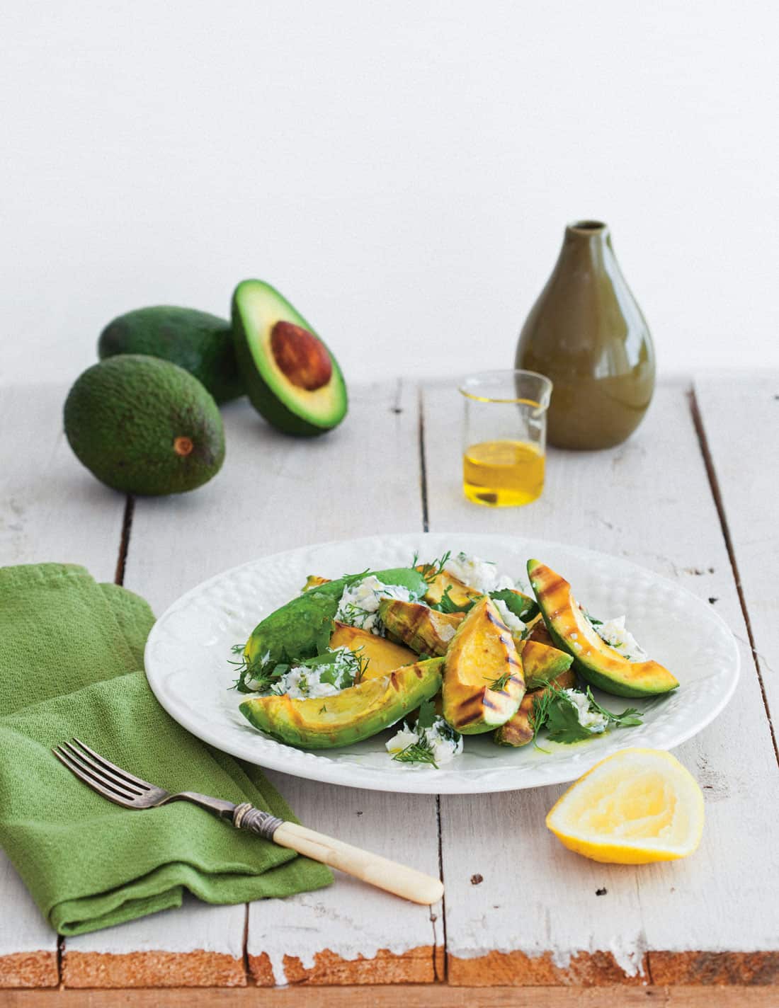 Barbecued avocado with herb labneh salad