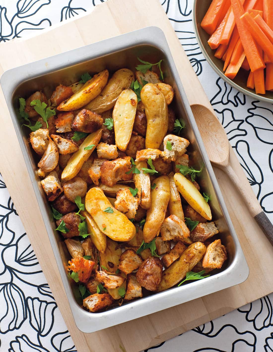 Baked sausages with potatoes and rosemary