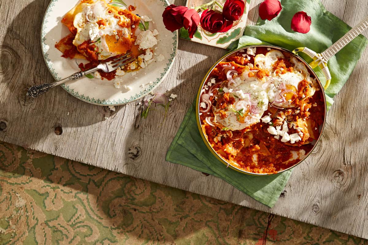 Tomato and chipotle bathed corn chips with fried eggs (chilaquiles rojas)