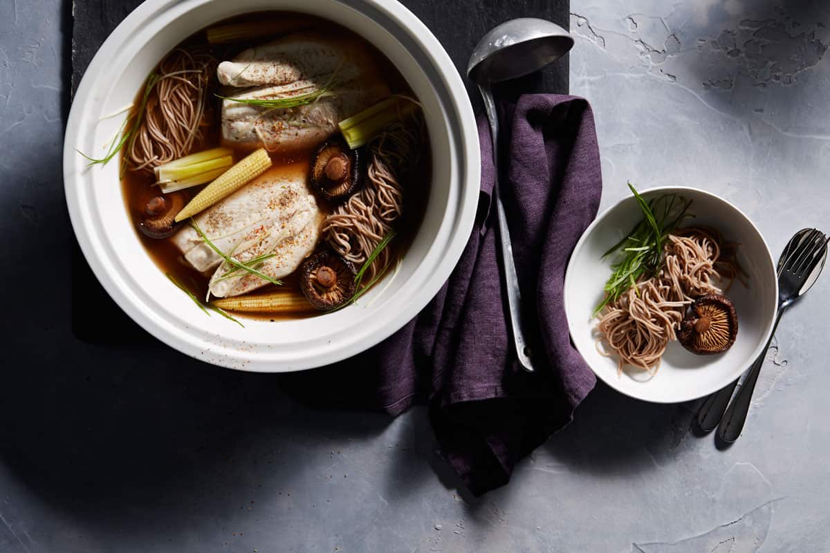 Japanese-style mushroom and leek broth with poached fish