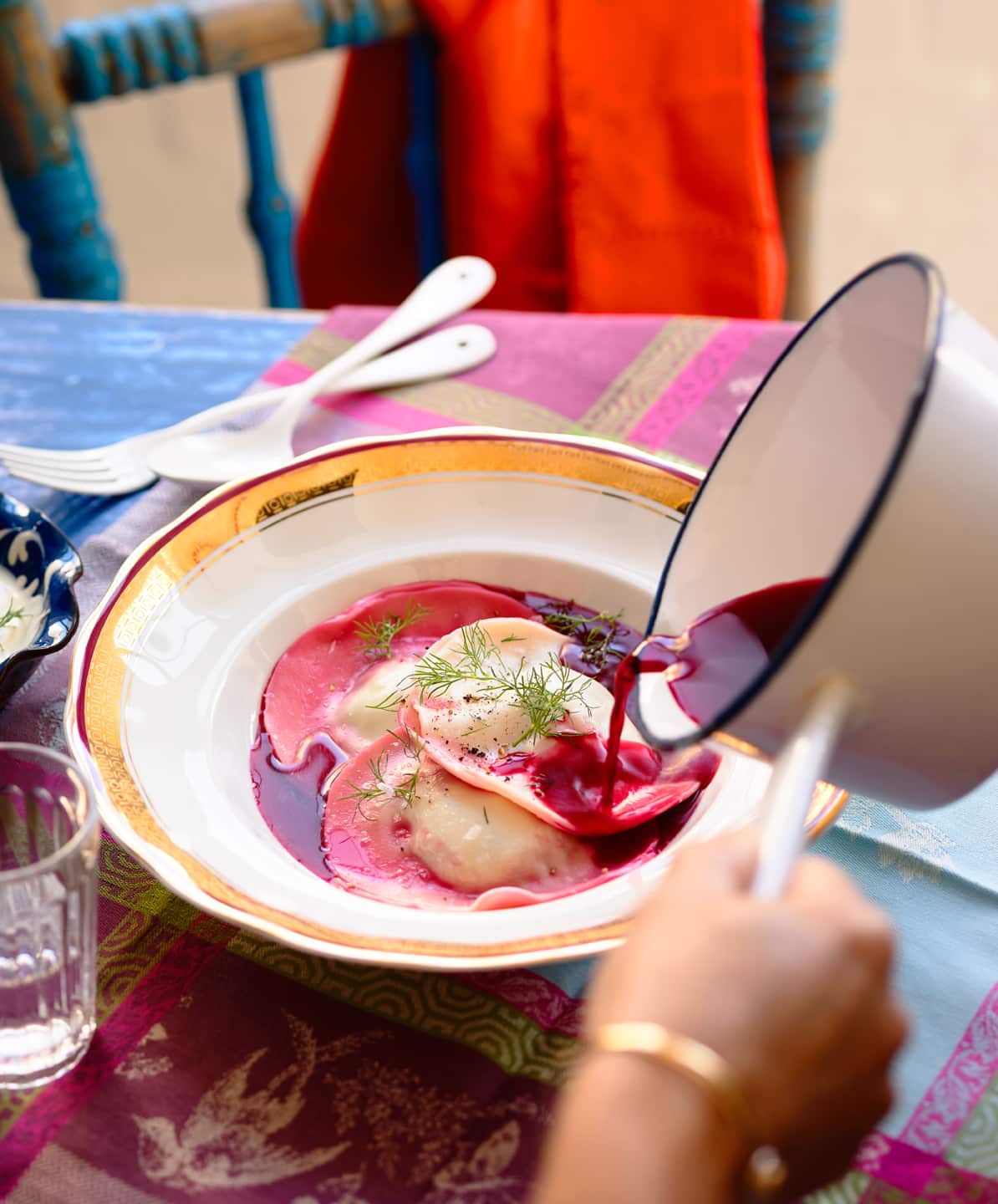 Potato ravioli in beetroot broth