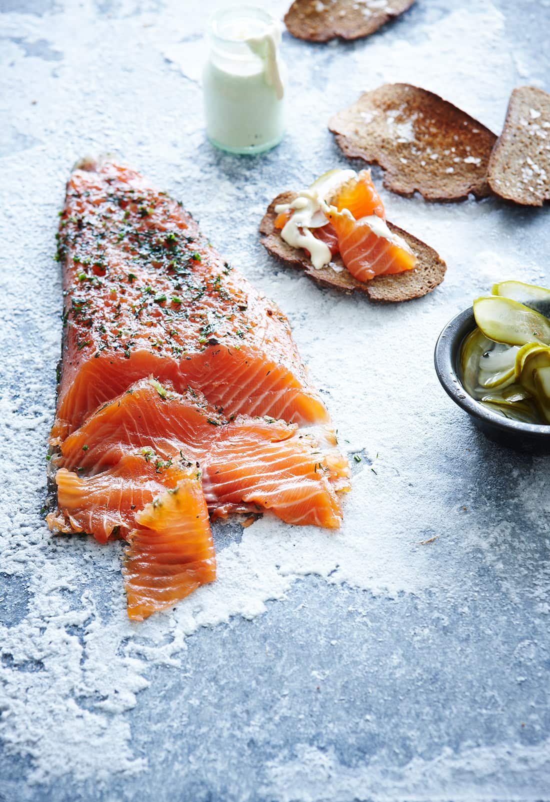 Salmon gravlax with Dijon crème fraîche dressing and pickled cucumbers