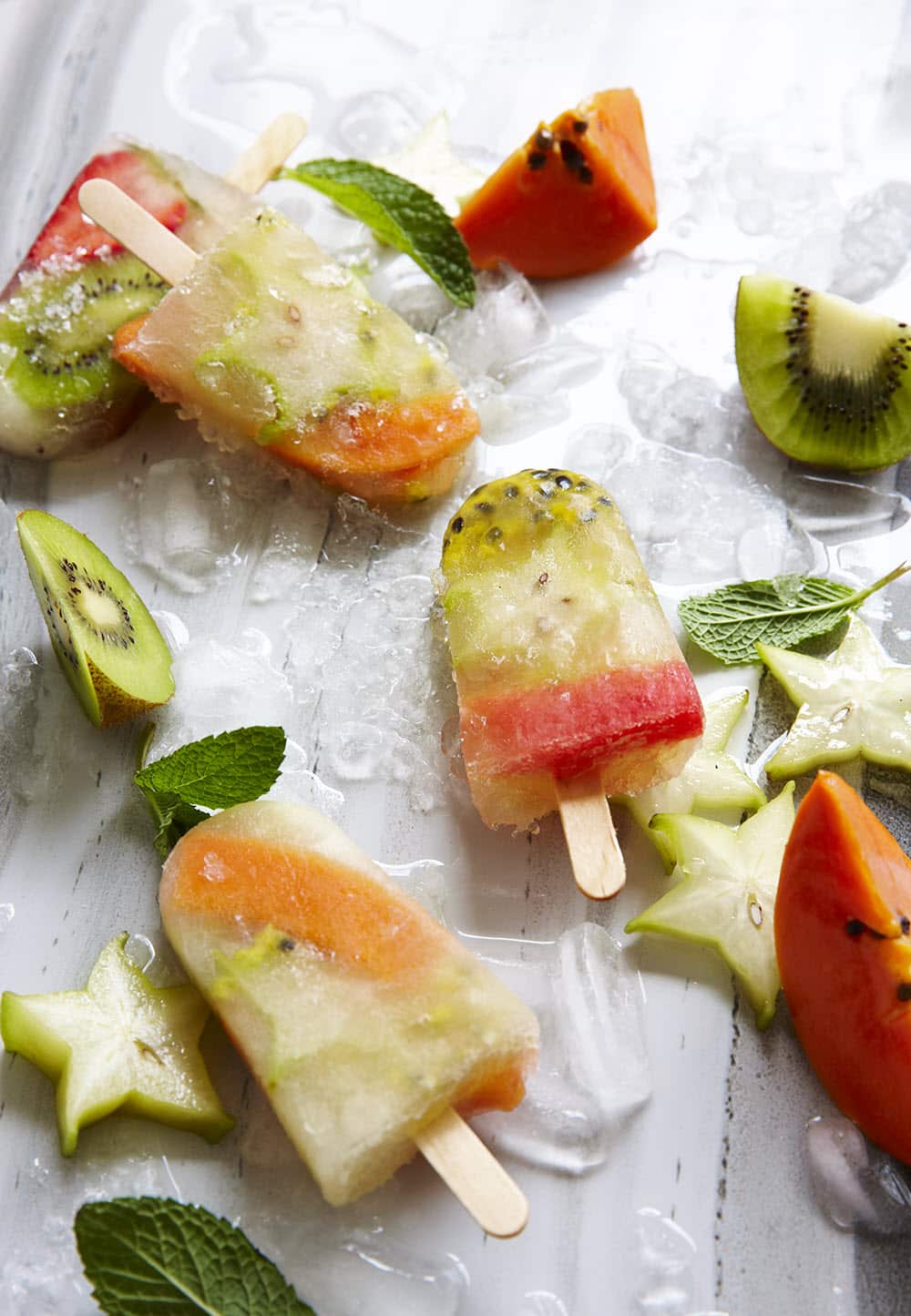 Homemade lemonade and tropical fruit ice pops