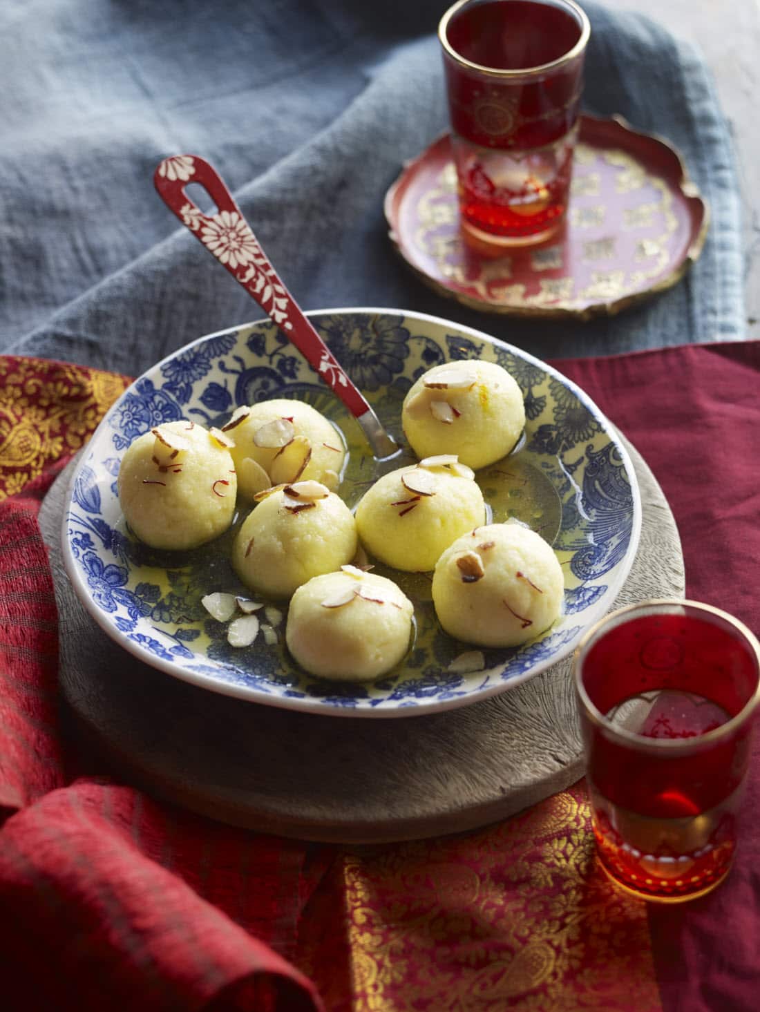 Paneer balls in saffron sugar syrup (rasgulla)