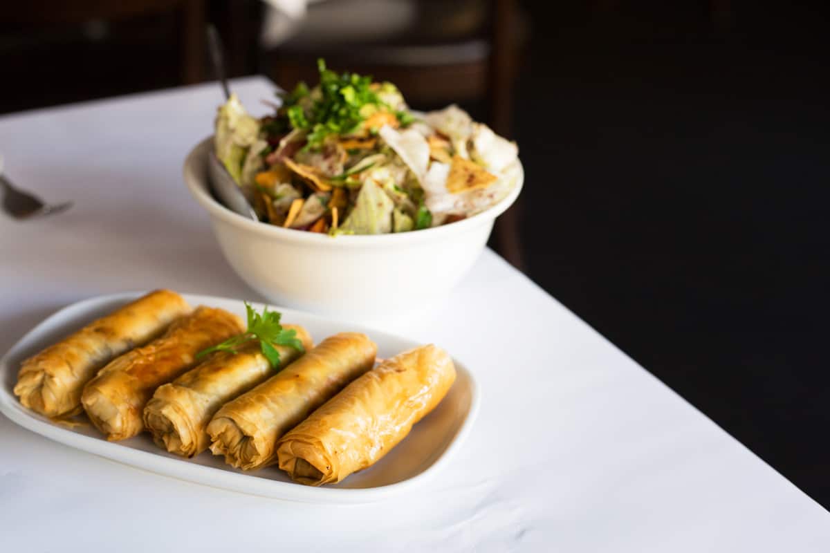 Filo pastry cigars filled with mince lamb and fattoush at Abla's.
