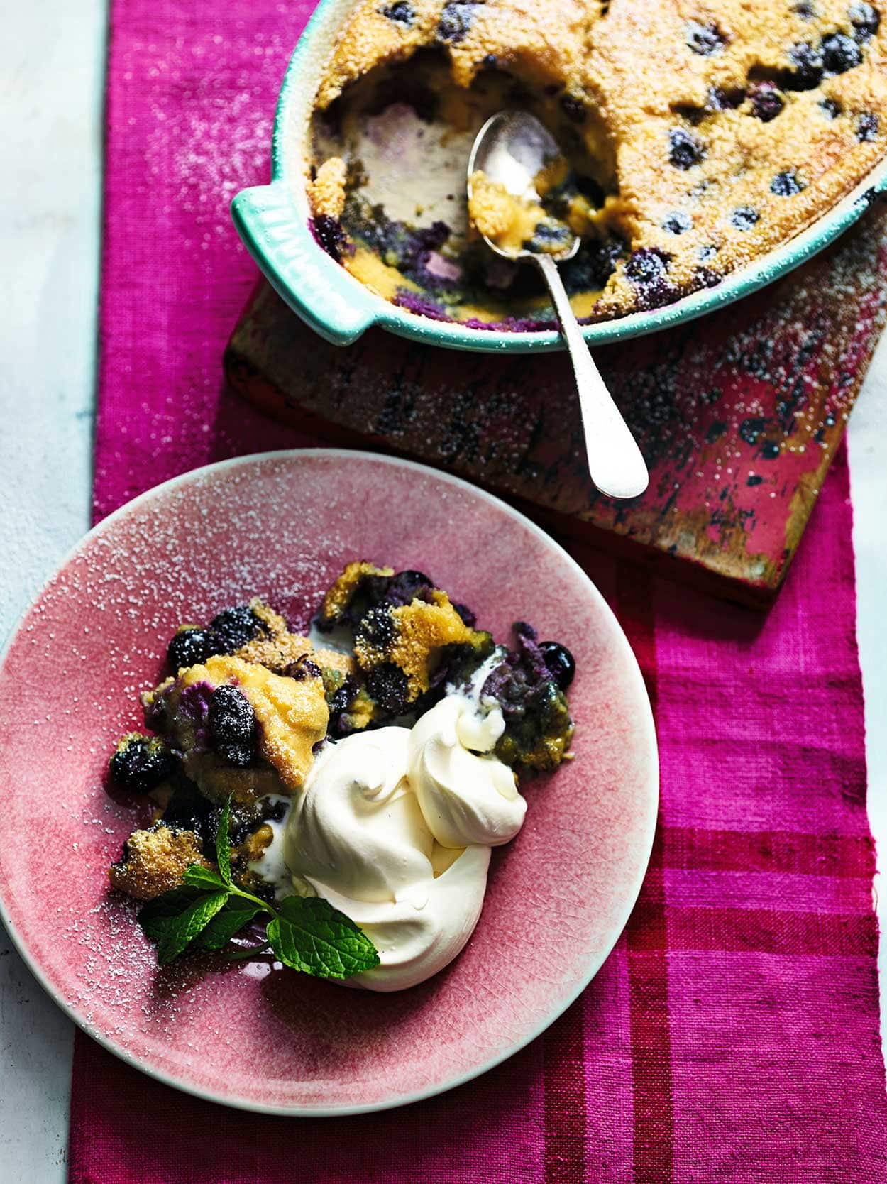 Blueberry and almond clafoutis with cardamom cream from book Ainsley's Good Mood Food