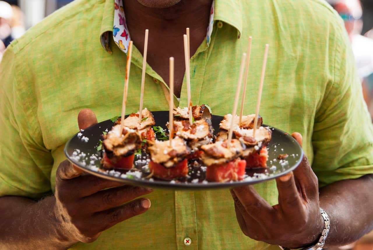 Chargrilled jerk pork on watermelon and coconut salad
