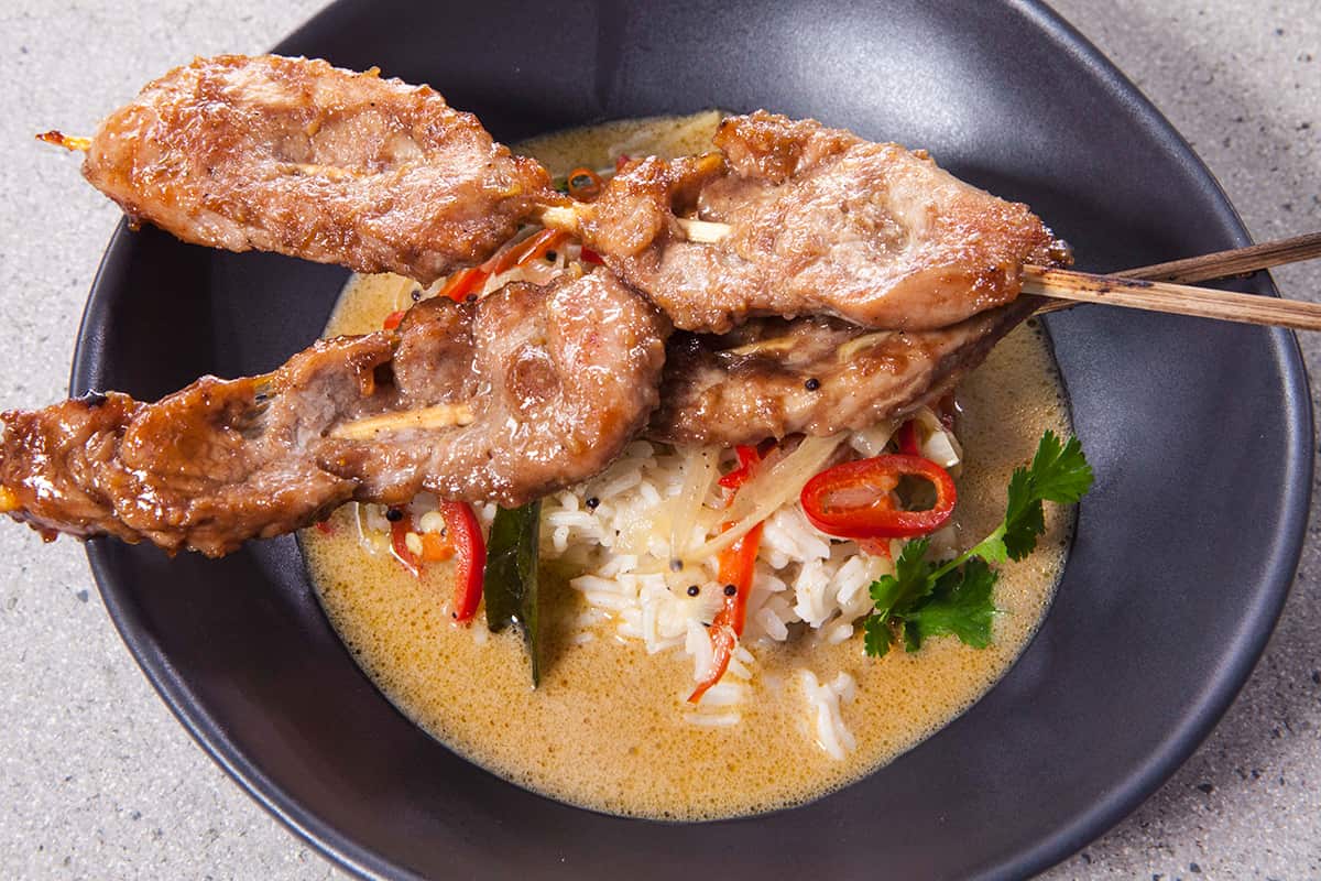 Spice grilled pork with noodles and coconut broth