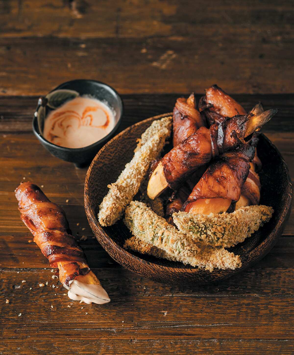 Bacon-wrapped sweet potato with avocado wedges