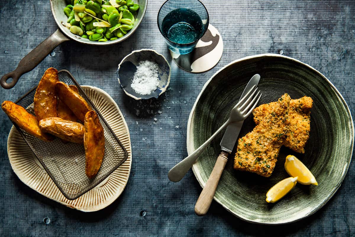 Baked fish and chips with broad beans
