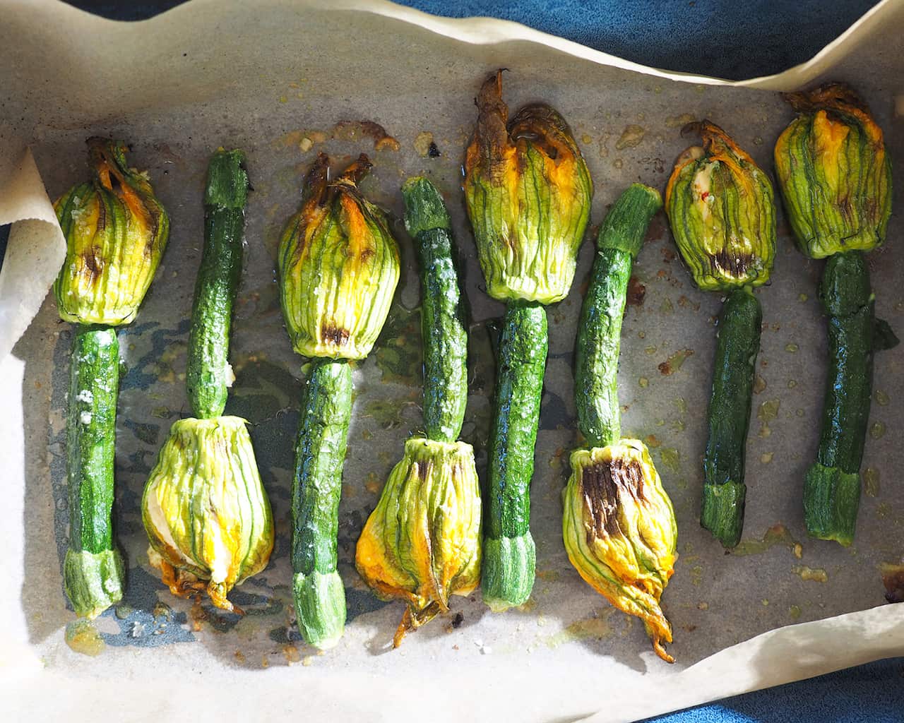 Baked zucchini flowers with ricotta and mint