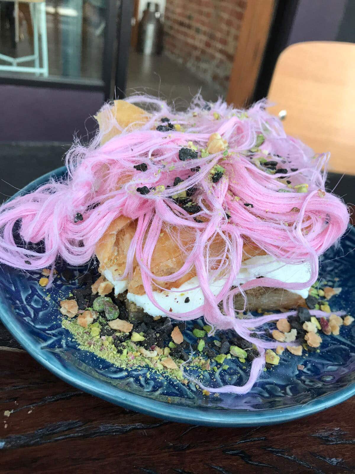 Cuppa Turca's house special is dondurma in between baklava topped with fairy floss and nuts.