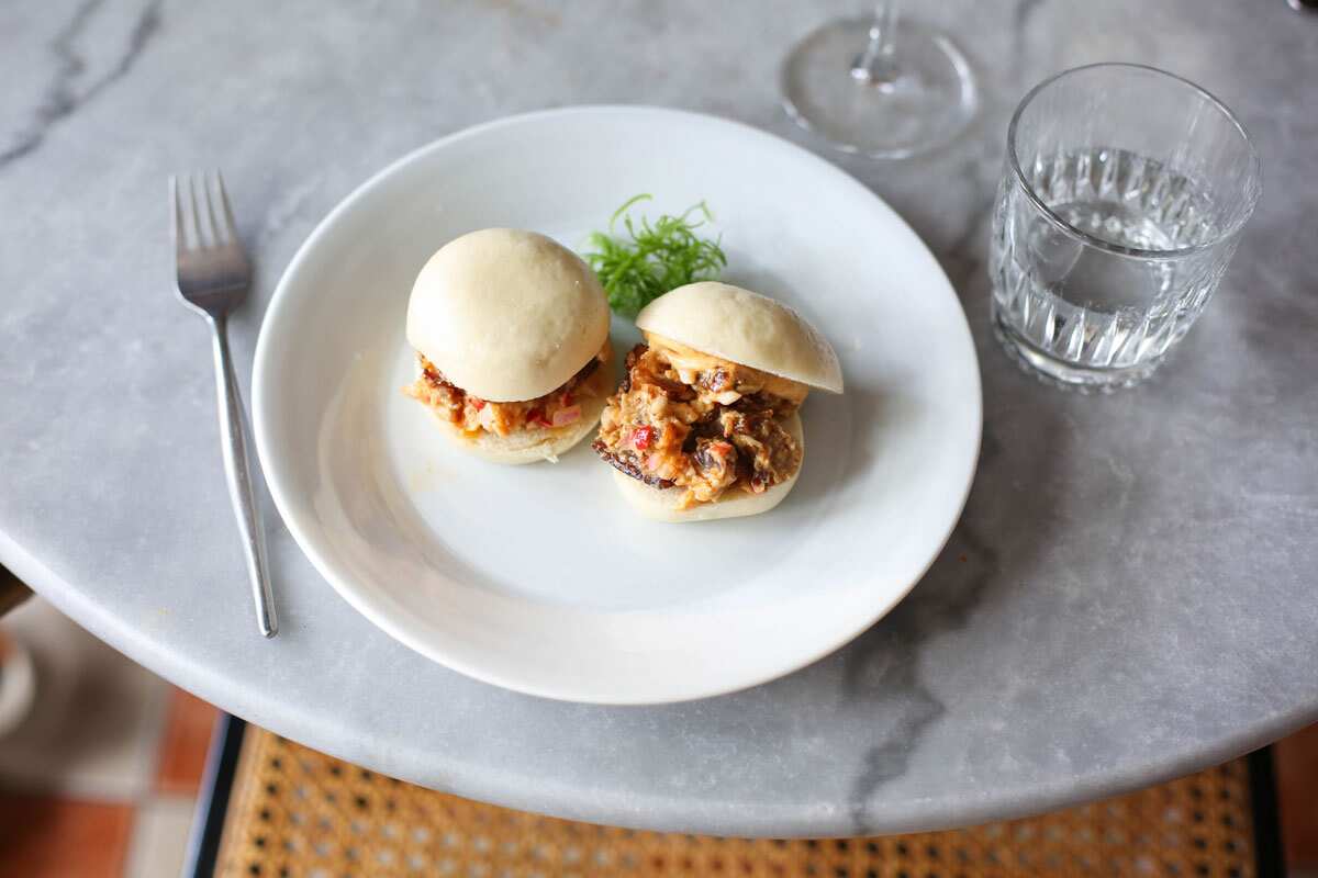 Sio Pao Sliders with sisig and smoked chilli adobar aioli highlight Bayad's contemporary spin on Filipino flavours.