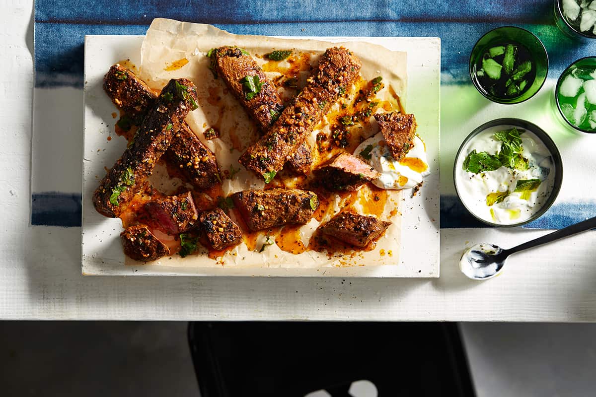 Barbecued lamb (mechoui) with minted yoghurt