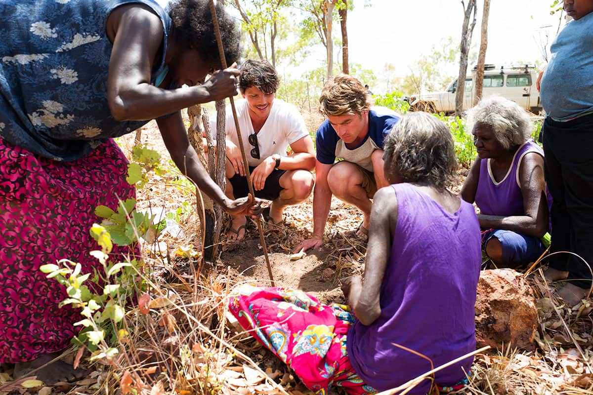 Churchill and Quinn dig up a native honey ‘sugarbag' in Katherine.