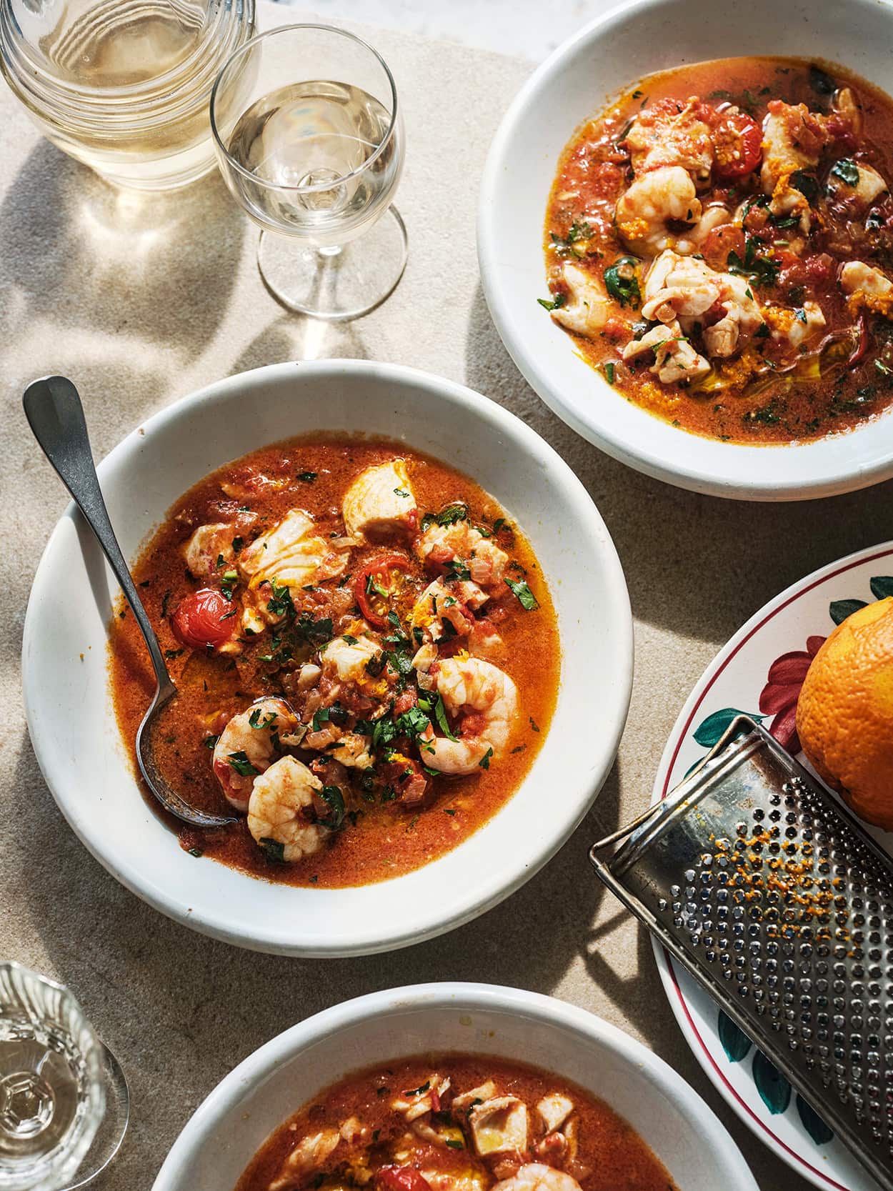 Spicy fish soup with tomatoes and orange zest