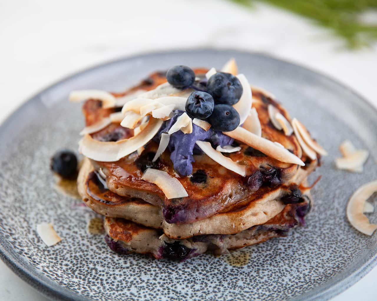 Gluten-free blueberry buckwheat pancakes with blueberry coconut cream