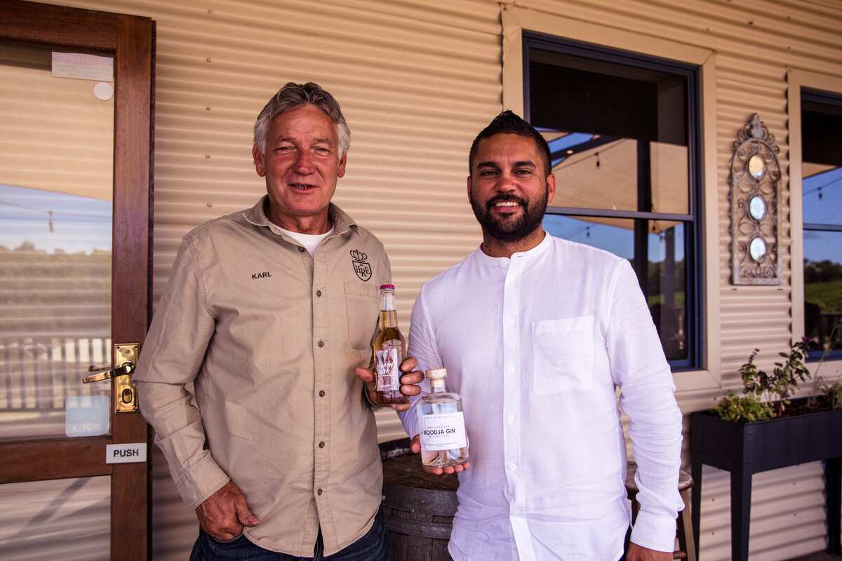 Phillip Ugle (right) proudly displays his The Forager 'Boodja' Gin with Karl Hillier of Harris River Estate.