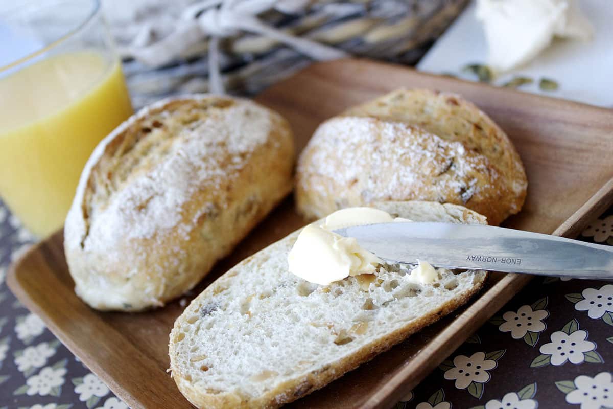 Butter being spread on bread