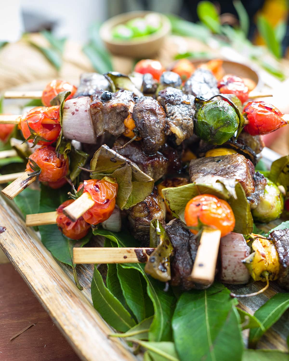 Grilled beef skewers with pepper berry sauce