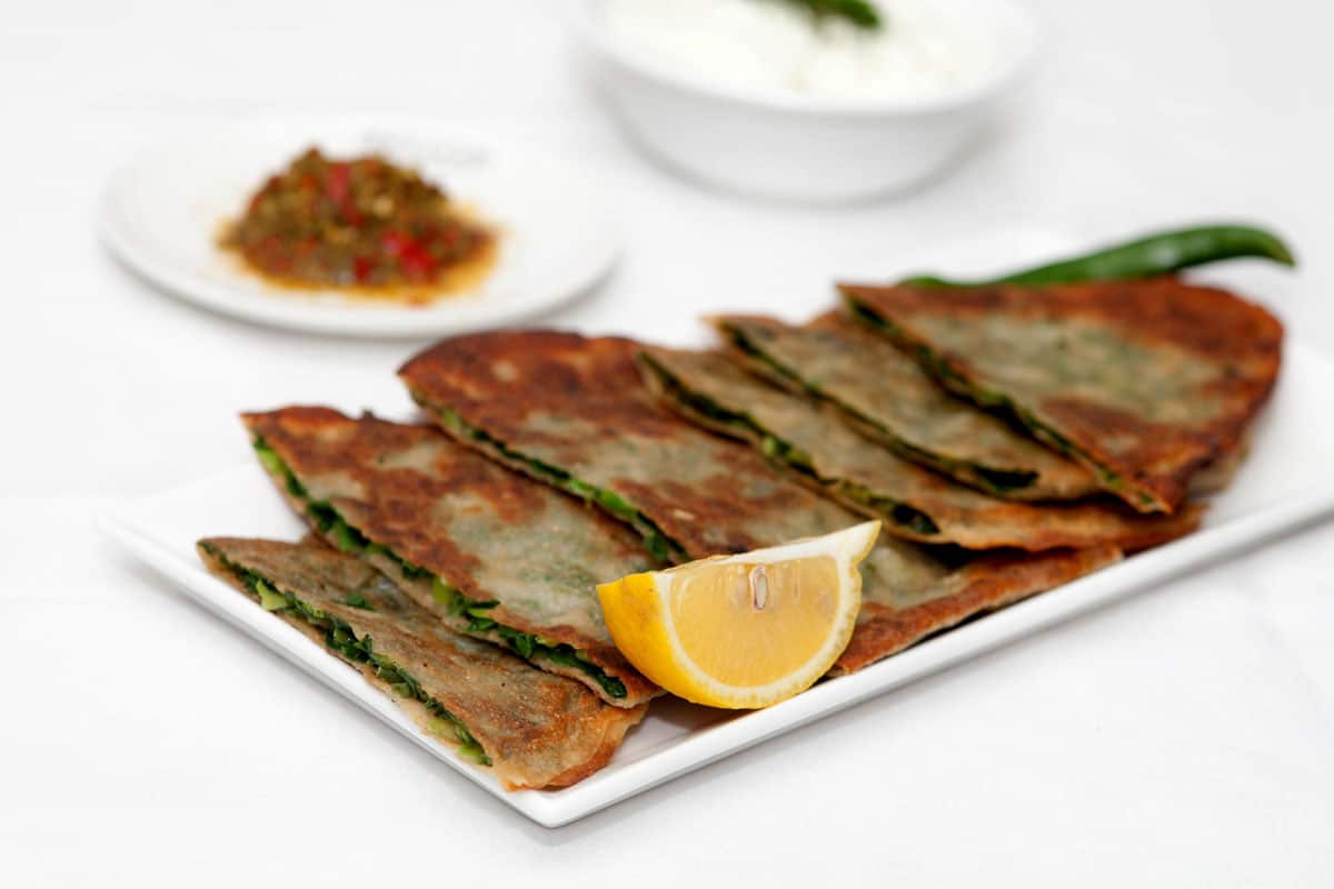 Bulanee Gandana is an Afghan flatbread turnover filled with vegetables and herbs. (Khaybar)