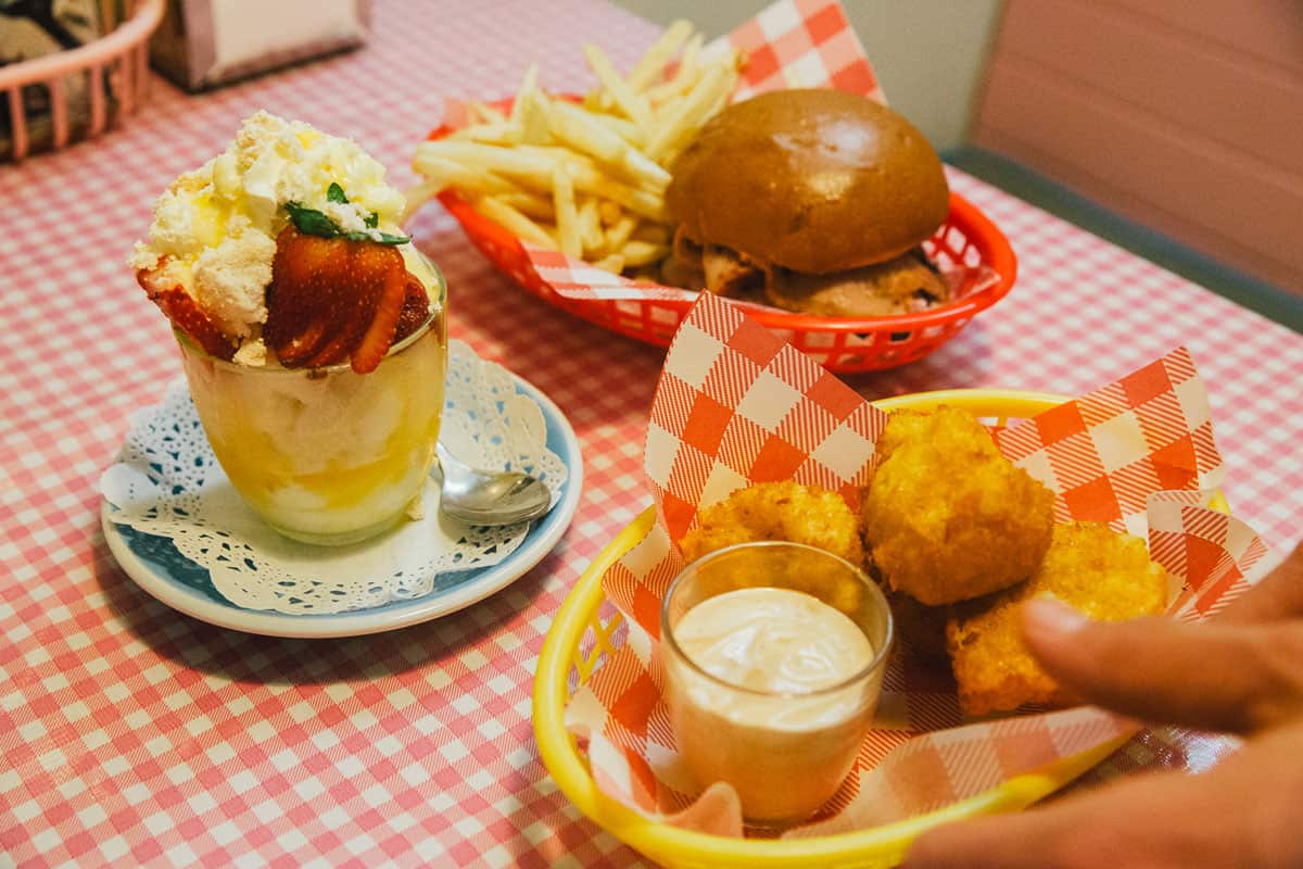 Mac ‘n’ cheese balls, meat-pie jaffles, chicken schnitty dippers and fairy bread are among the retro eats on offer in the cafe.